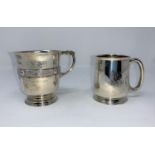 A silver christening mug with Celtic band, monogrammed, London 1946; a similar plain mug, Birmingham