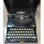 An early 20th century Remington 'Home Portable' typewriter in case; Bells Punch Company adding