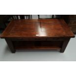 A rustic style hardwood coffee table of 2 tiers with 3 drawers