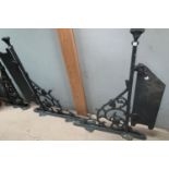 A large pair of ornate Victorian cast iron wall brackets and similar bracket