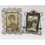 An Edwardian Art Nouveau easel photo frame in brass, 22 cm; and another 25 cm