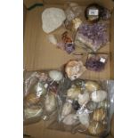 A selection of amethyst and other rock specimens; a collection of onyx and other eggs