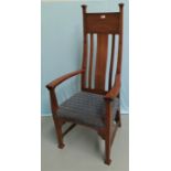 An Art Nouveau walnut armchair with high back, on square supports