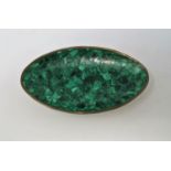 A malachite oval dish with brass rim 26cm x 15cm