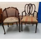A 1930's mahogany armchair with cane back and needlework seat; a Georgian style mahogany armchair