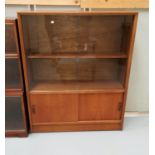 A 1960's teak display cabinet with 2 glass and 2 panelled doors by Gibbs furniture