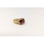 A gent's 9 carat hallmarked gold signet ring, set garnet, 52 gm