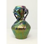 An Art Nouveau pottery vase of organic form with iridescent glaze, in the manner of Pecs, 23 cm