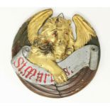 A carved and painted wood roundel, with gilded lion of St Mark, 24 cm; a tin tray, painted and