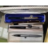 2 modern Parker fountain pens with brushed steel lids and a Parker ballpoint pen