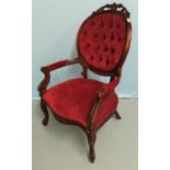A Victorian mahogany framed armchair, the oval back with carved crest, knurled arms and legs,