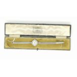 A 1930's ladies Vertex cocktail watch, the white metal case set 24 diamonds, stamped '18ct', strap