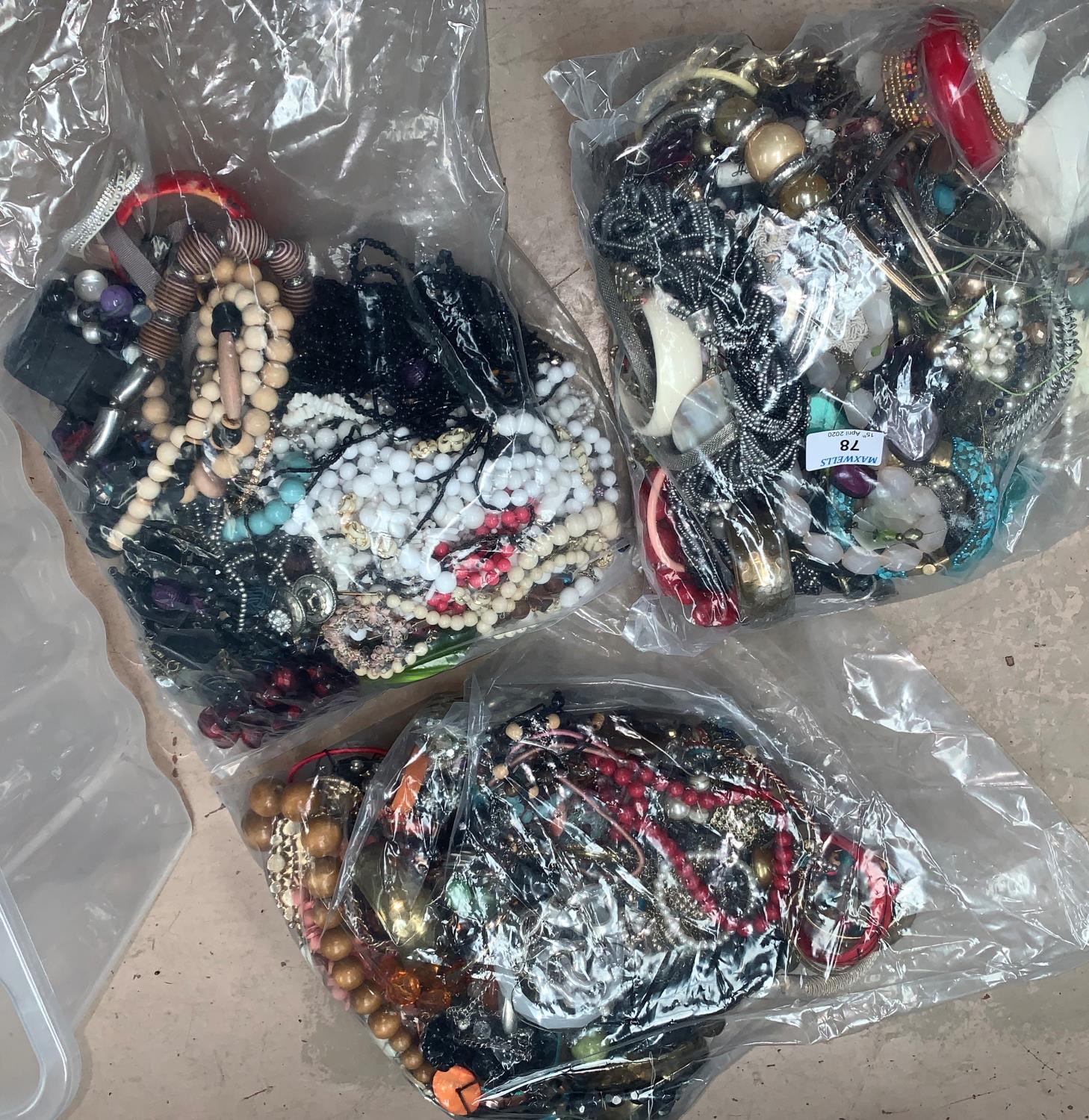 a large selection of unsorted modern costume jewellery in 3 sealed bags