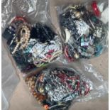 a large selection of unsorted modern costume jewellery in 3 sealed bags