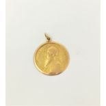 A Middle Eastern yellow metal pendant with bearded mullah profile 'Abdul Baba', tests as 18 ct, 5.