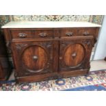 A 19th century continental carved oak cabinet with marble top, 2 frieze drawers and double cupboard,