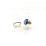 A child's yellow metal signet ring set cabochon oval blue stone, stamped '10K', 6.1 gm; a yellow and