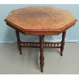 An Edwardian octagonal centre table, quarter veneered marquetry inlay, on turned legs and