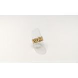 A wide engraved wedding ring with internal inscription, unmarked, tests as 14 ct, 6.3 gm