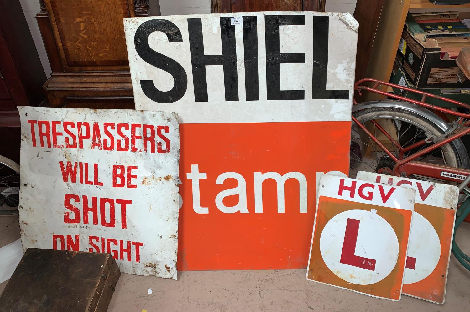 A 'Shell Stamp' metal sign; 2 HGV 'L' plates; a sign 'Trespassers will be shot'