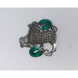 Georg Jensen, an unusual Danish silver and enamel pierced brooch, a lamb with green enamel leaves