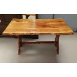 A rustic yew wood refectory kitchen table