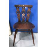 A pair of Ercol Fleurs de Lys dining chairs