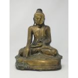A Chinese bronze and gilt figure of a Buddha in seated position height 33cm