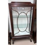 A 1920's mahogany small display cabinet with oval panel doors, on cabriole legs