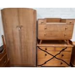 A 1960's gent's light oak wardrobe, part fitted; a matching dressing table/desk