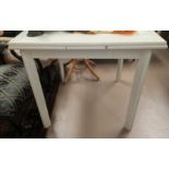 A white laminate draw leaf kitchen table and 4 ladder back chairs