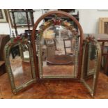 A free standing triple dressing table mirror in barbola frame