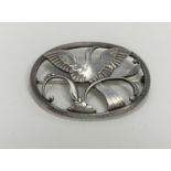 A Georg Jensen silver brooch stamp 925s Denmark, number 238 featuring Bird of Paradise on branch, in