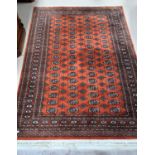 A Modern rust ground Bakhara rug width 158 cm