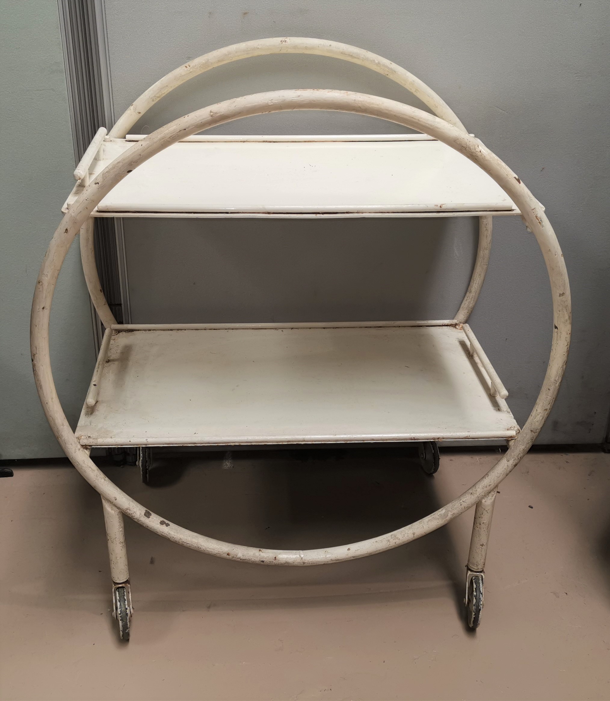 An Art Deco tubular metal 2 tier trolley in later white painted finish