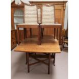 A 1960's teak drop leaf dining table with rectangular top; 4 G-Plan dining chairs;