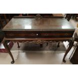 A GI style parcel gilt and walnut side serving table with 2 friezed drawers and carved cabriole legs