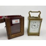 A 19th century brass carriage clock with timepiece movement in original red leather outer case; 3