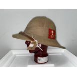 Lancashire Fusiliers, a tropical pith helmet, WWII period, red cloth badge, and stand