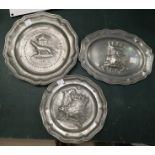 Three pewter plaques depicting coats of arms