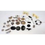 A large selection of costume jewellery brooches: micro-mosaic; 'bog oak' mourning brooches; etc.