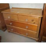 A Victorian stripped pine chest of 2 long and 2 short drawers