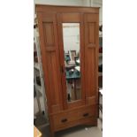 An Edwardian satin walnut single wardrobe with mirror door