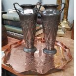 A pair of WMF tapering 2 handled pewter vases with embossed Art Nouveau flared decoration; a