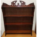 An Edwardian 4 height bookcase; a rush seat bedroom chair; a wicker chair