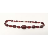A cherry amber colour necklace, 62gm