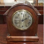 An Edwardian mantel clock in arch top mahogany case