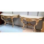 A pair of 19th century console tables in the Rococco manner with scroll and accanthus supports in