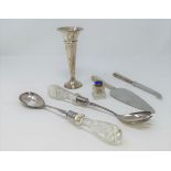 A pair of hall marked silver salad servers with glass handles, a silver handled cake knife and