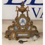 A 19th century French ormulur rococo style mantel clock inset porcelain panels, 8 day striking